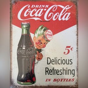 Coca-Cola Red and White Retro Bottle Sign with Playful Character